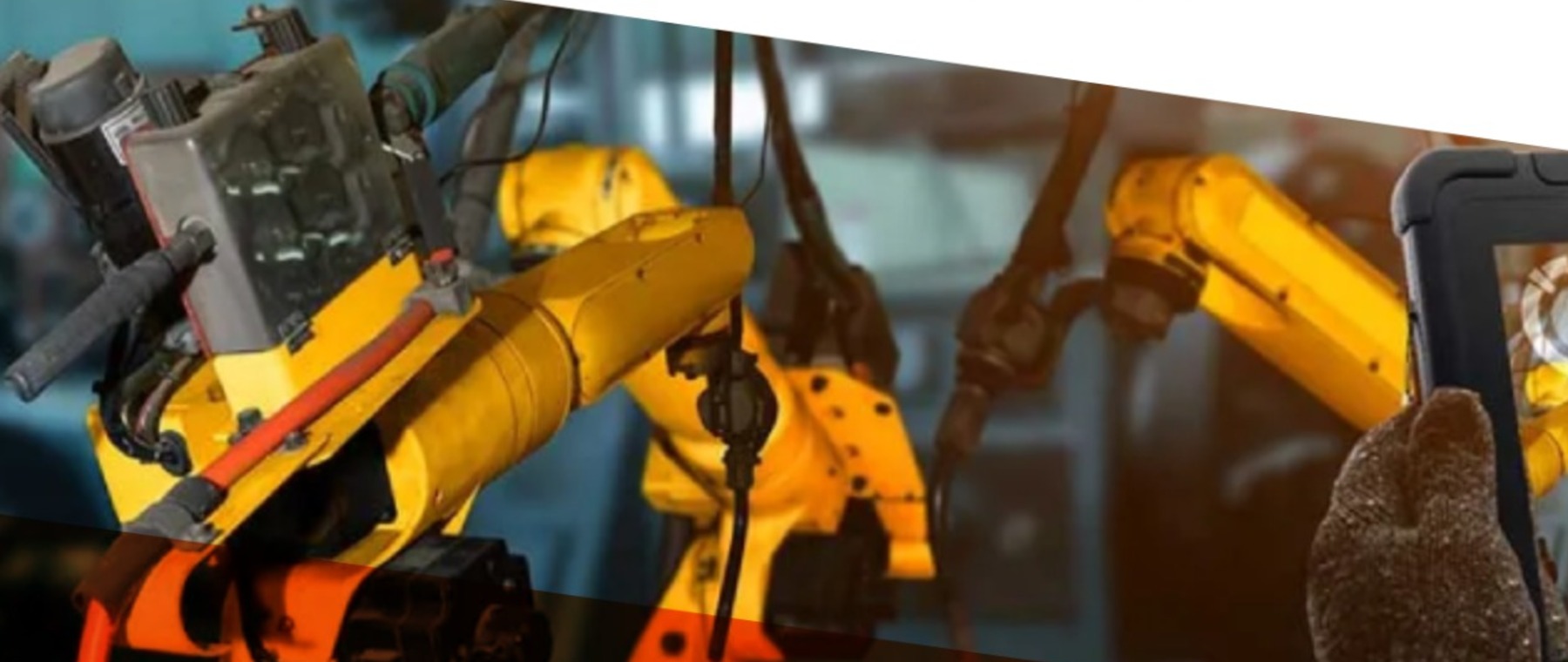 Technician working on automated industrial equipment